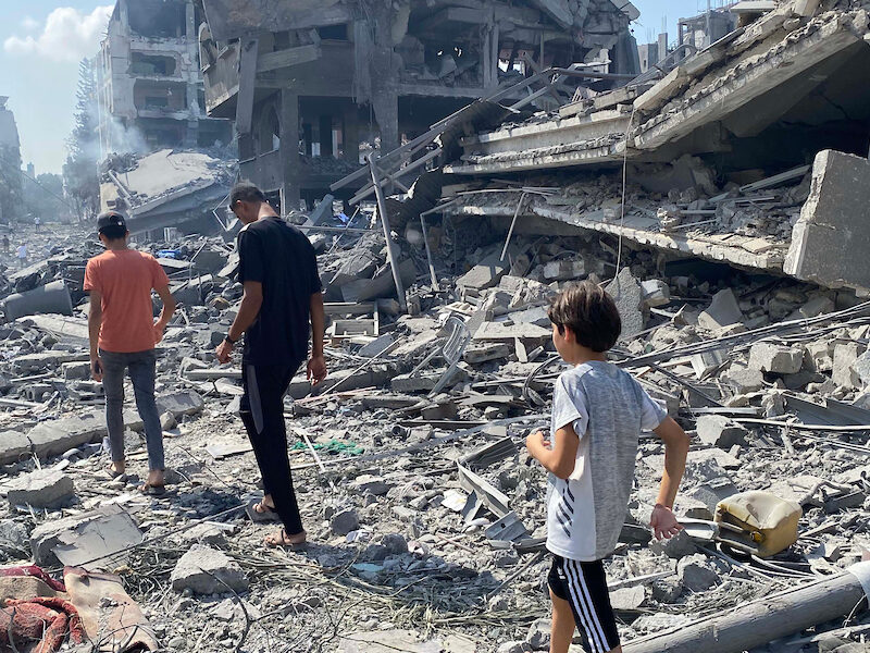 Palestinians inspect the damage following an Israeli airstrike on the El-Remal aera in Gaza City on October 9, 2023.