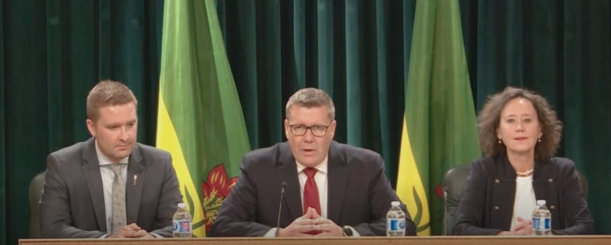 Saskatchewan Premier Scott Moe holds a news conference following the passage of the "parents' bill of rights," accompanied by Minister of Education Jeremy Cockrill (L) and Minister of Justice Bronwyn Eyre (R).