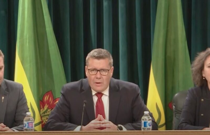 Saskatchewan Premier Scott Moe holds a news conference following the passage of the "parents' bill of rights," accompanied by Minister of Education Jeremy Cockrill (L) and Minister of Justice Bronwyn Eyre (R).