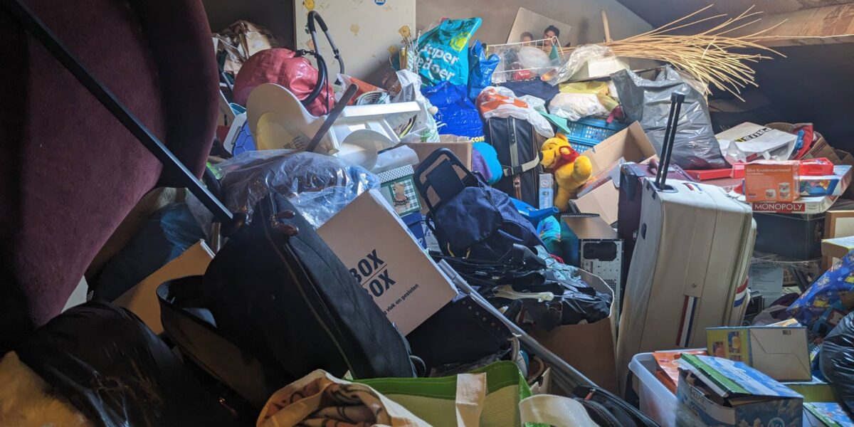 A room filled with piles of stuff. An example of hoarding.