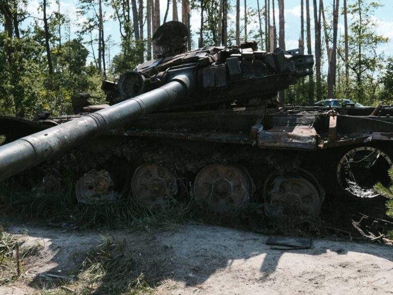 A destroyed tank in a Ukrainian forest.