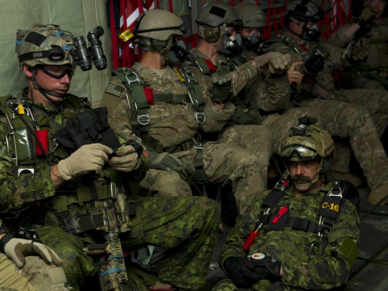 Canadian and American special forces soldiers pictured sitting on an airplane in 2013.