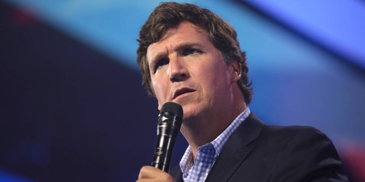 Tucker Carlson speaking with attendees at the 2022 AmericaFest at the Phoenix Convention Center in Phoenix, Arizona.