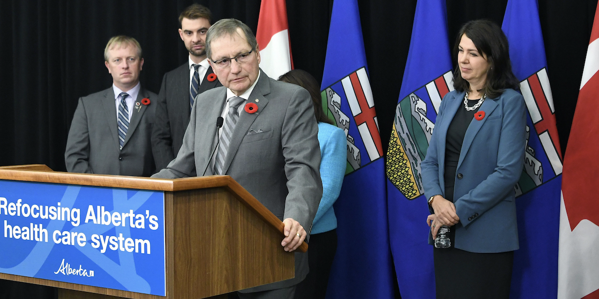 Ed Stelmach at a press conference with Alberta Premier Danielle Smith.