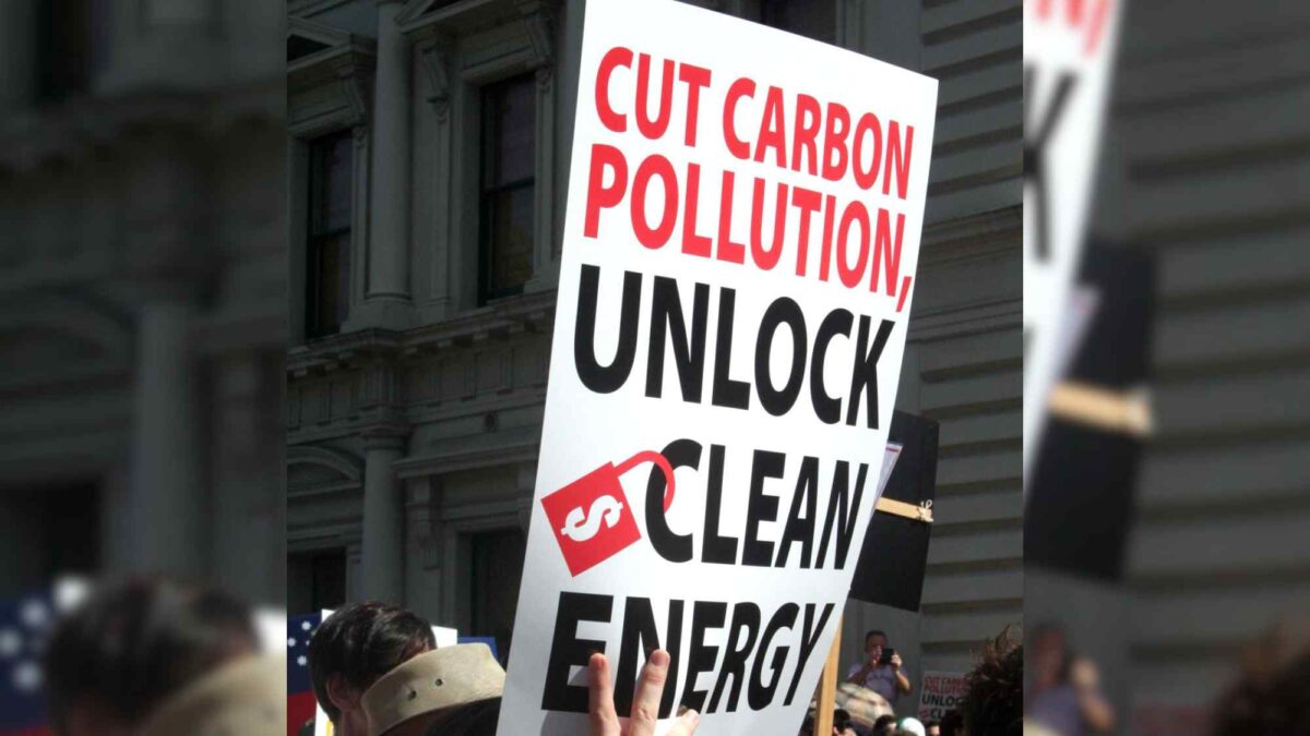 A sign calling for the reduction of carbon pollution.