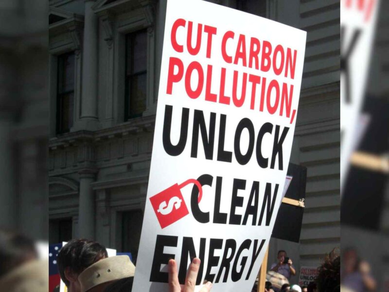 A sign calling for the reduction of carbon pollution.