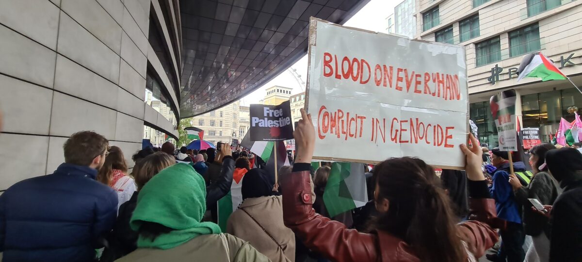 A person protests genocide in Gaza.