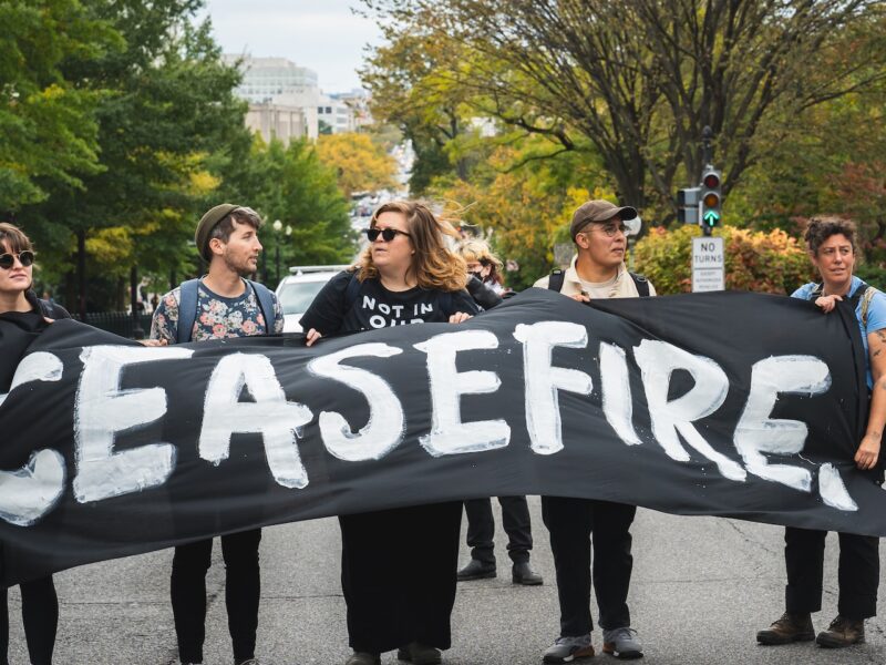 A group of people hold a banner reading "ceasefire" in Washington, D.C.