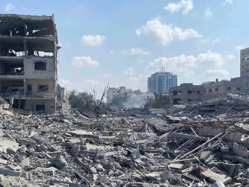 Palestinians inspect the damage following an Israeli airstrike on the El-Remal area in Gaza City on October 9, 2023.