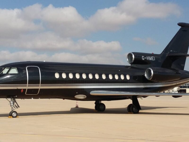 A photo of a black private jet.