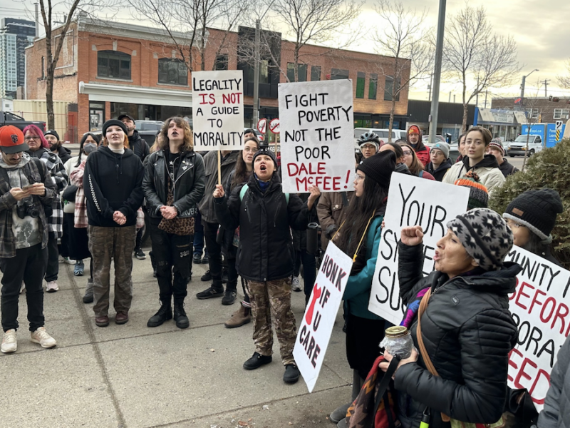 Opponents of sweeps of homeless encampments protested in downtown Edmonton yesterday.