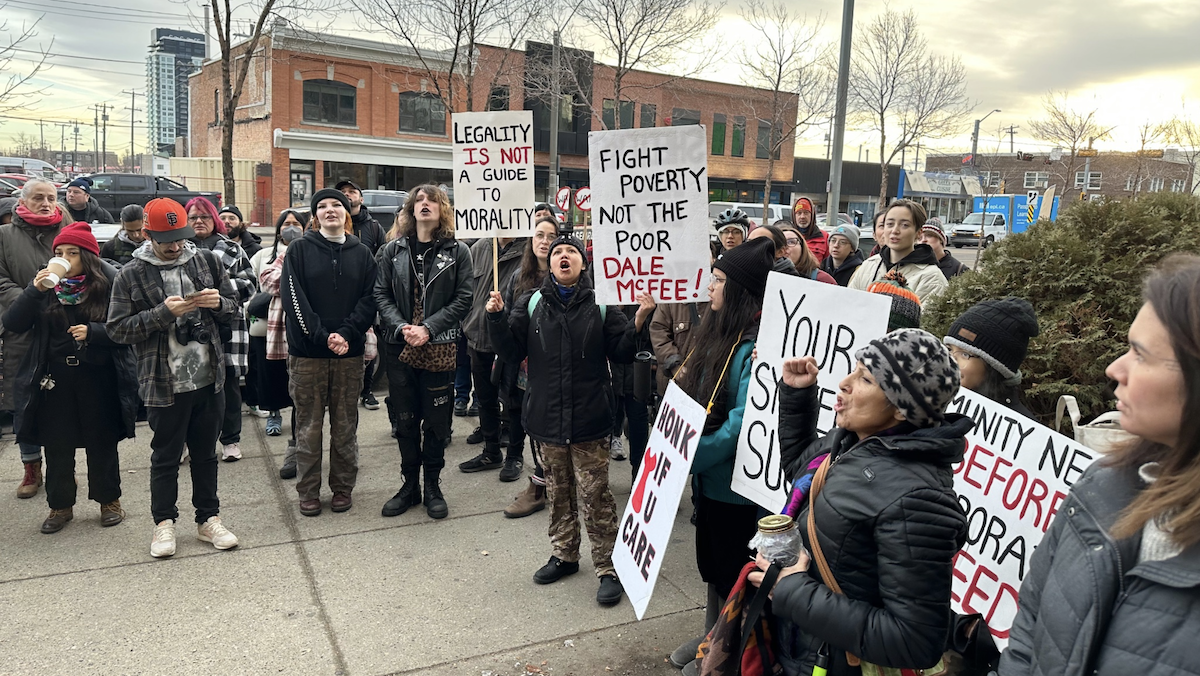 Opponents of sweeps of homeless encampments protested in downtown Edmonton yesterday.