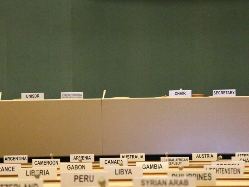 An image of empty tables at a UN assembly. Canada is currently working against a UN convention that would make the global tax system more fair.