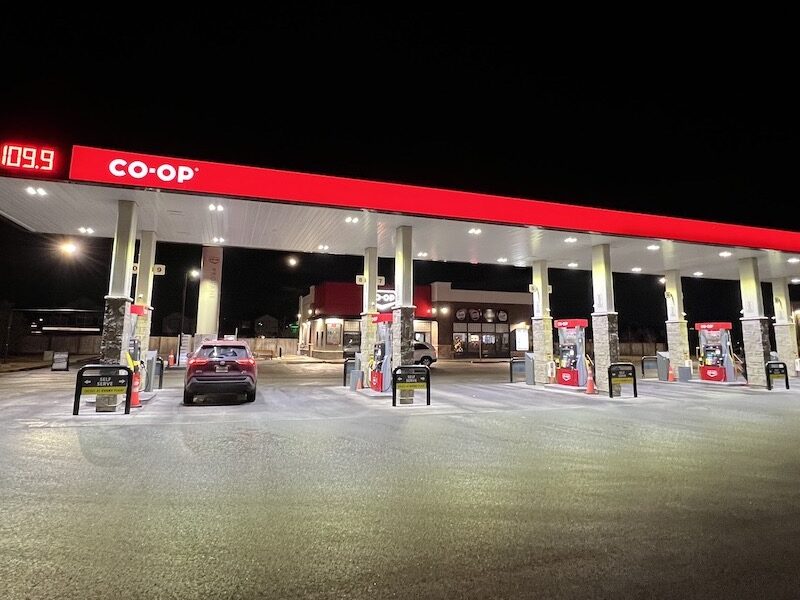 A Co-Op gas station at night with a price of $1.09 a litre.