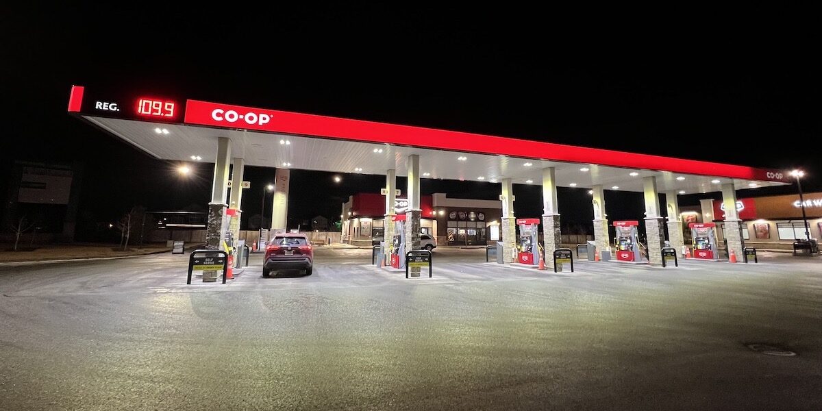 A Co-Op gas station at night with a price of $1.09 a litre.