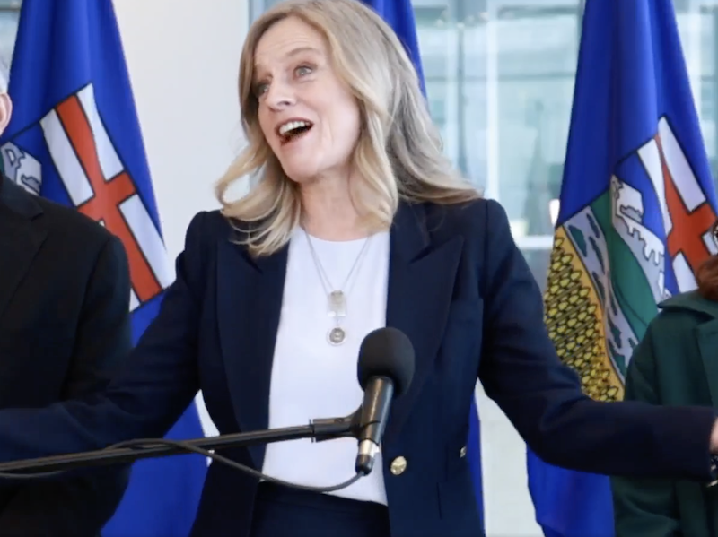 Rachel Notley, flanked by her husband and daughter, at the news conference yesterday at which she announced she would step down as Alberta’s Opposition leader.