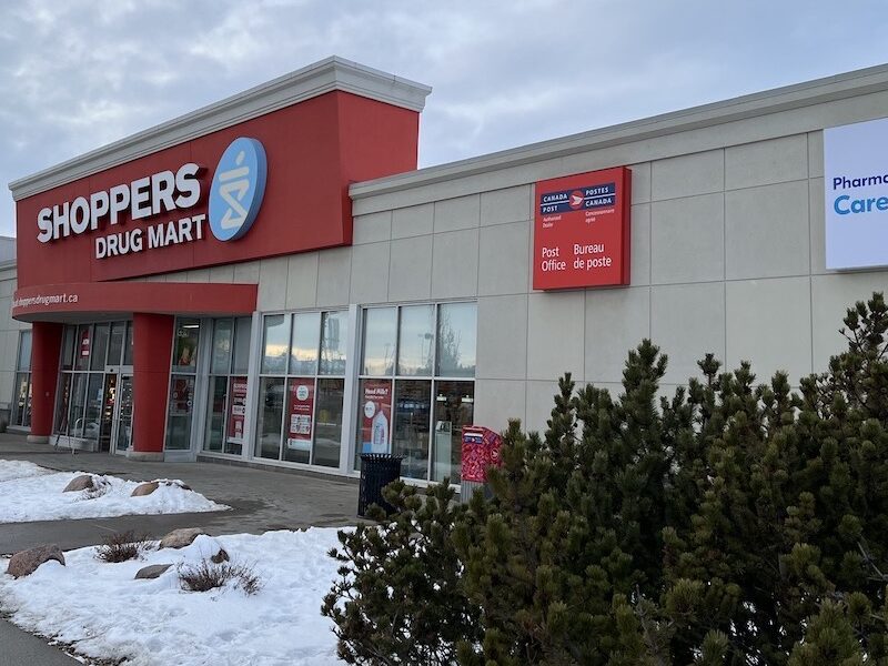 The outside of a Shoppers Drug Mart pharmacy in winter.