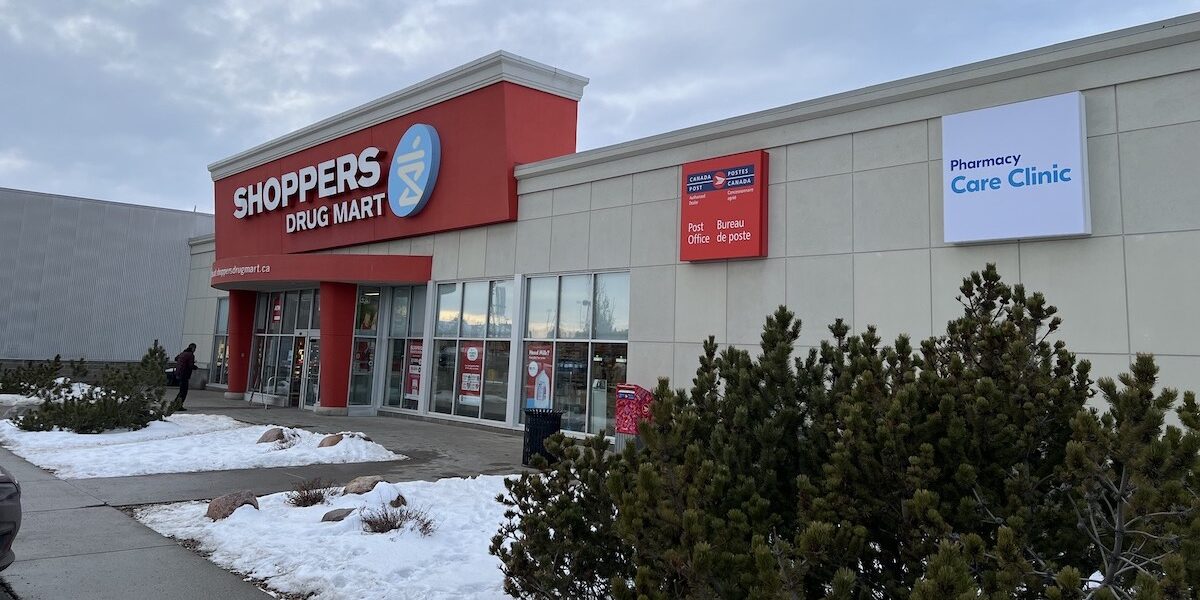 The outside of a Shoppers Drug Mart pharmacy in winter.