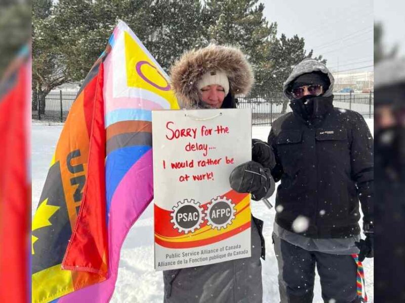 Striking union workers on the picket line in Kingston, Ontario.