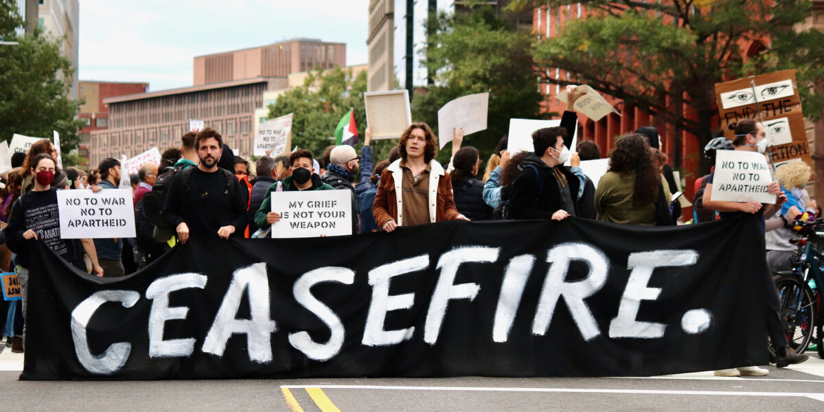 Ceasefire banner displayed during protest of war on Gaza