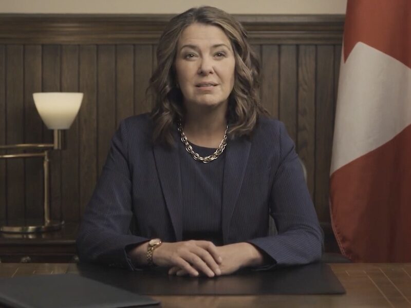 Alberta Premier Danielle Smith giving a televised address.