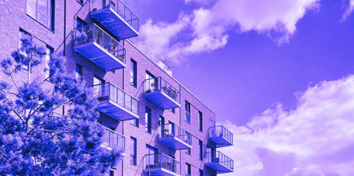 A view of apartment buildings with a purple filter.