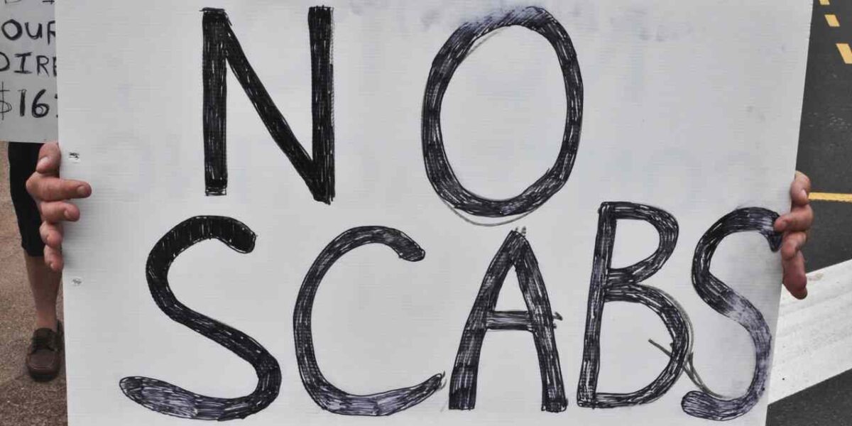 A sign reading "no scabs."