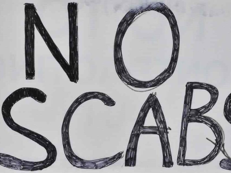 A sign reading "no scabs."