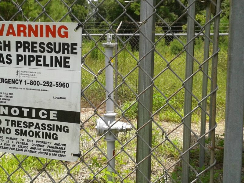 A warning sign for a natural gas pipeline.