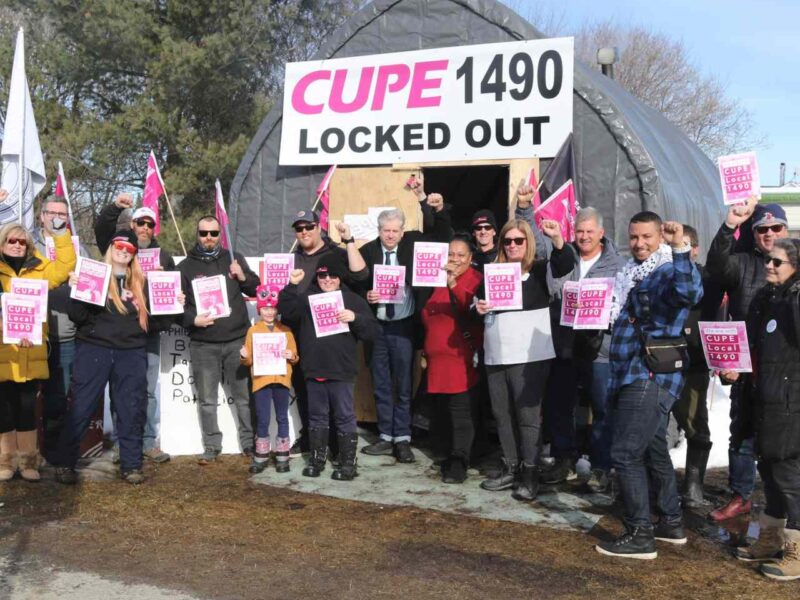 A group photo that includes members of the OFL,, OPSEU, CUPE Local 1490 and MP Charlie Angus.