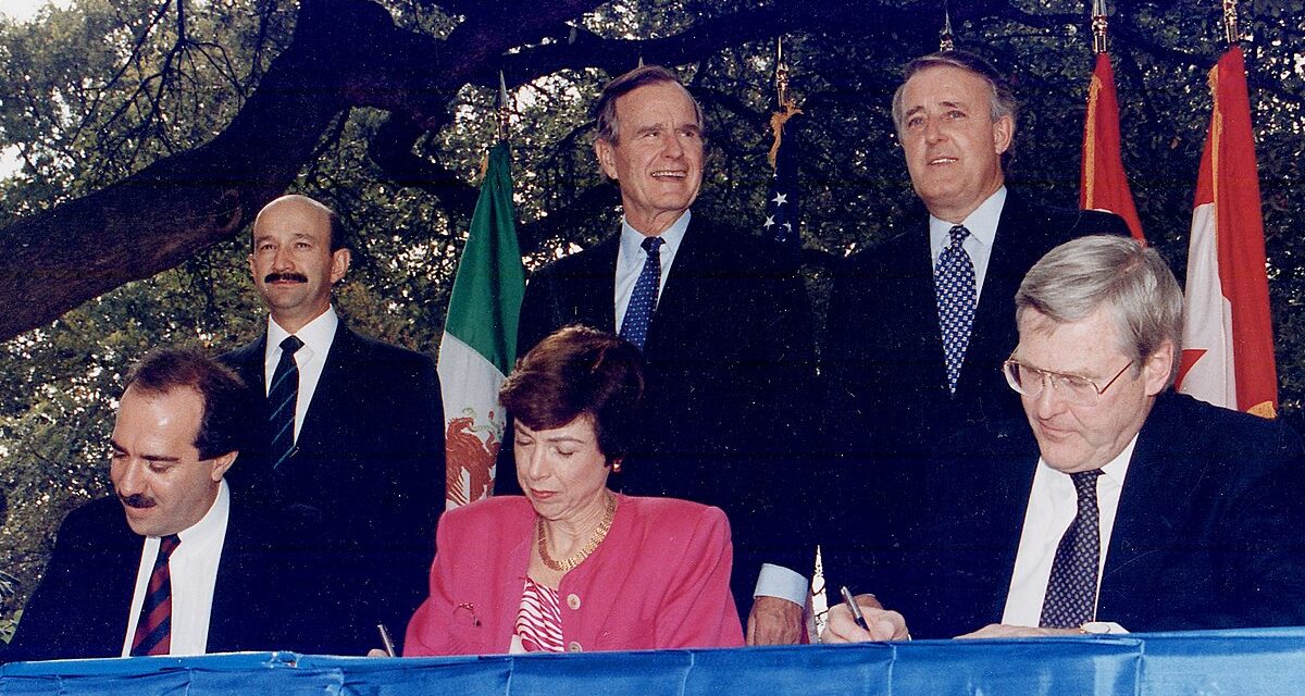 U.S. President George Bush, Prime Minister Brian Mulroney and Mexican President Carlos Salinas participate in the initialling ceremony of the North American Free Trade Agreement in 1992.