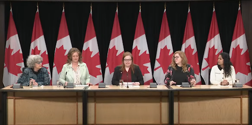 (From Left to Right, Judy Rebick, Honorable Lisa Hepfner, MP for Hamilton Mountain and Secretary to the Minister for Women and Gender Equality, Nancy Wilson, Canadian Women’s Chamber of Commerce (CANWCC), Tracey Ramsey, Canadian Freelance Union/Unifor’s Women’s Director, Navya Baradi, Executive Director of the National Collective of Women in Business.