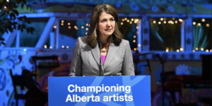 Alberta Premier Danielle Smith speaking at a podium.