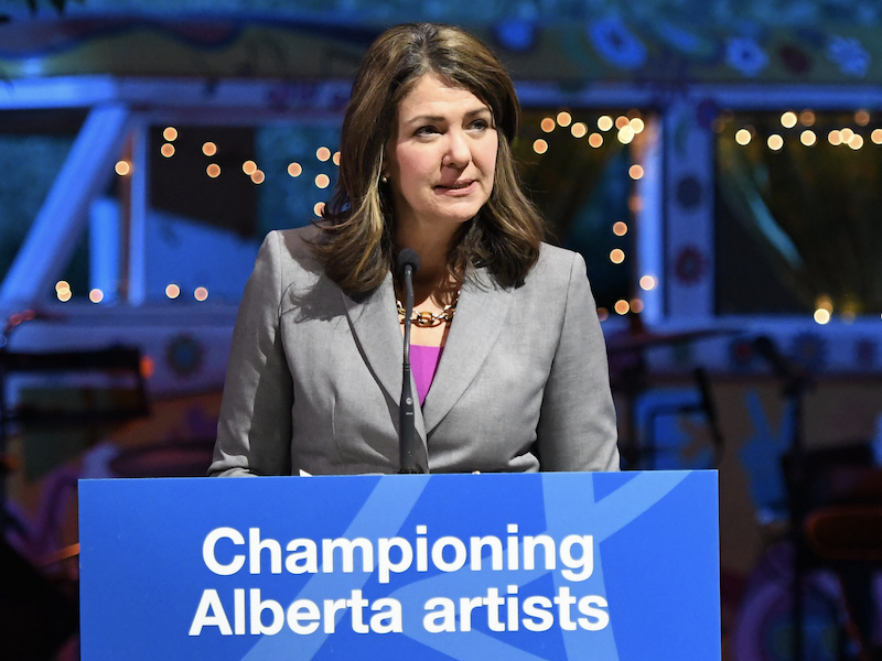 Alberta Premier Danielle Smith speaking at a podium.