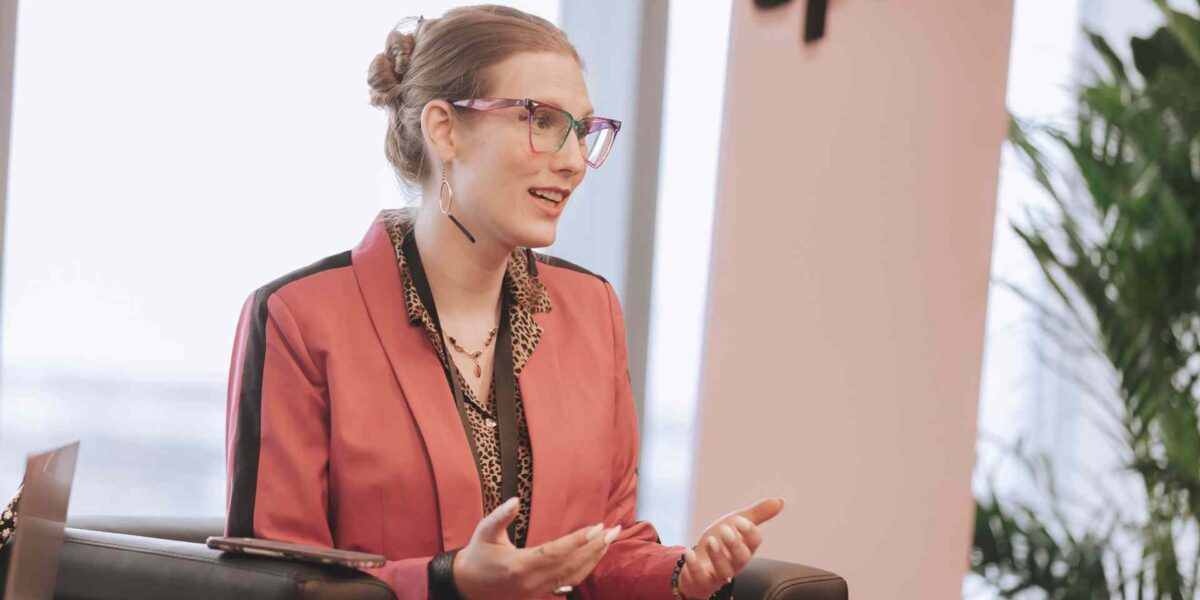 Jade Pichette (they/them), Director of Programs at Pride at Work Canada, leading a roundtable discussion about accessibility during SPARK 2023.