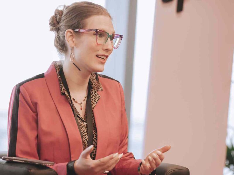 Jade Pichette (they/them), Director of Programs at Pride at Work Canada, leading a roundtable discussion about accessibility during SPARK 2023.