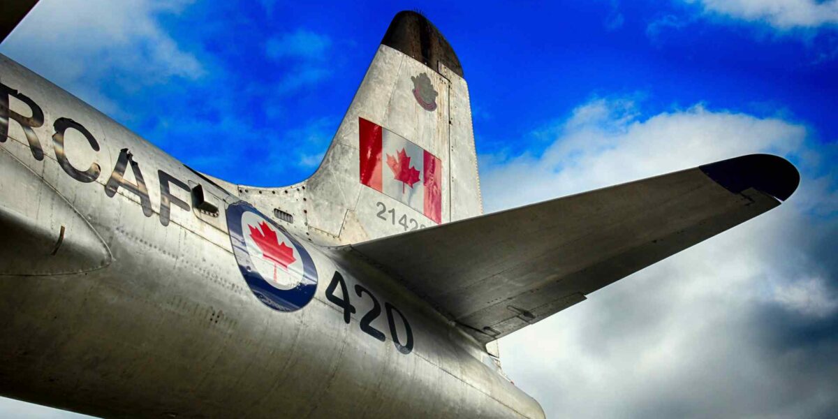 The tail section of an airplane with the RCAF logo and Canadian flag.