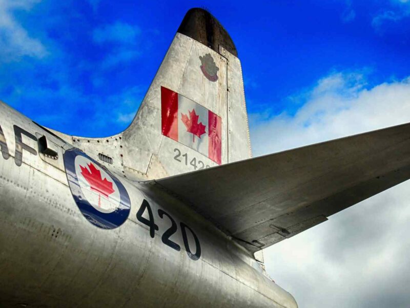 The tail section of an airplane with the RCAF logo and Canadian flag.