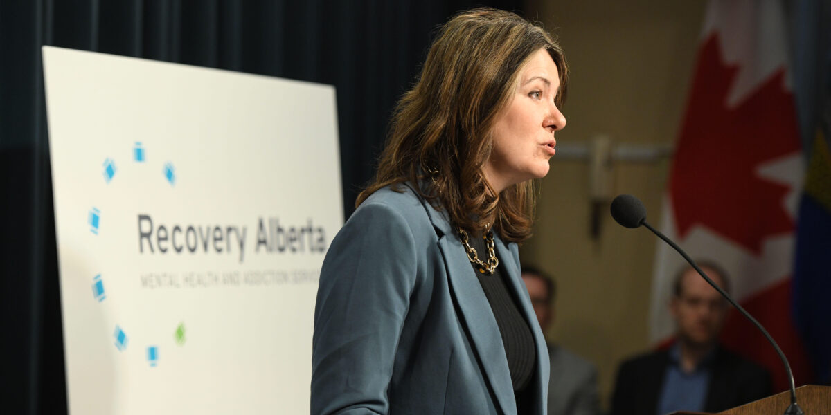 Premier Danielle SMith at a press conference announcing new mental health organizations.