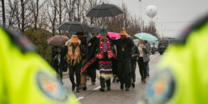 Wet'suwet'un Hereditary Chief Na'Moks and land defenders join the rally outside of RBC's 2024 AGM.