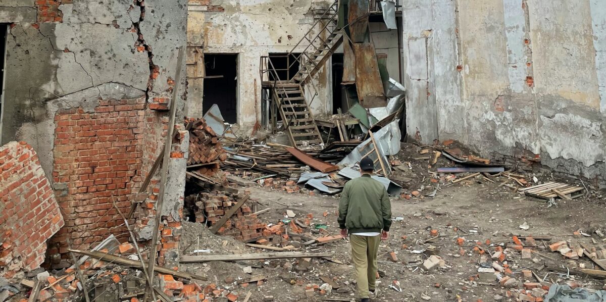 A person walks through a building in Chernihiv, Ukraine that was destroyed by an aerial bomb in the Russian war on Ukraine.