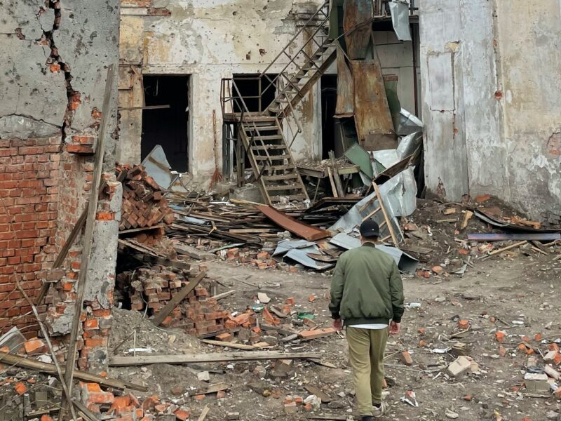 A person walks through a building in Chernihiv, Ukraine that was destroyed by an aerial bomb in the Russian war on Ukraine.