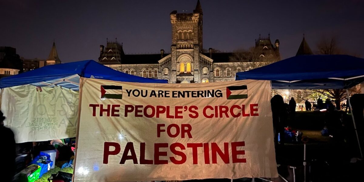 The entrance to the encampment at UofT, with a sign that reads "The People's Circle for Palestine."