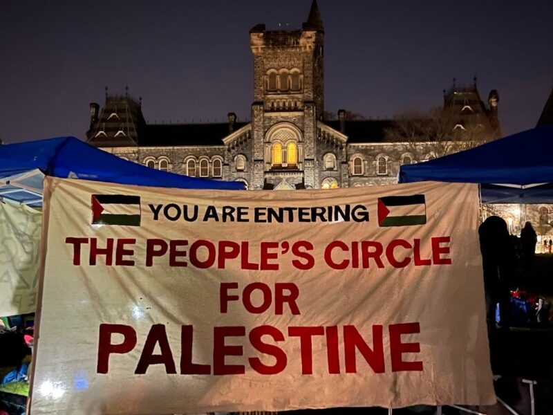 The entrance to the encampment at UofT, with a sign that reads "The People's Circle for Palestine."