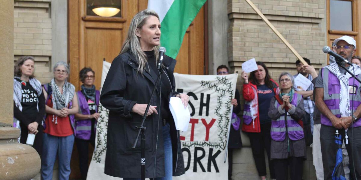 OFL president Laura Walton speaks at a rally in support of UofT students on Monday, May 27.