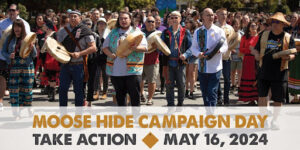 A group of Indigenous leaders with hide drums promoting the Moose Hide campaign.