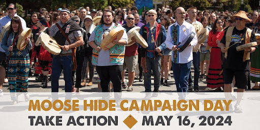 A group of Indigenous leaders with hide drums promoting the Moose Hide campaign.