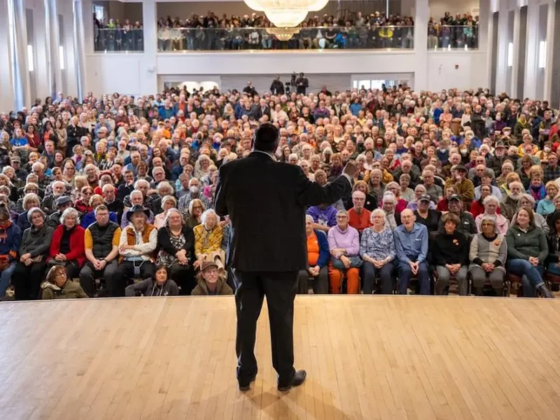 NDP leadership frontrunner Naheed Nenshi on stage.