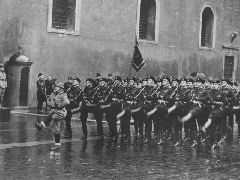 Benito Mussolini reviewing a parade pf Blackshirts in 1940.