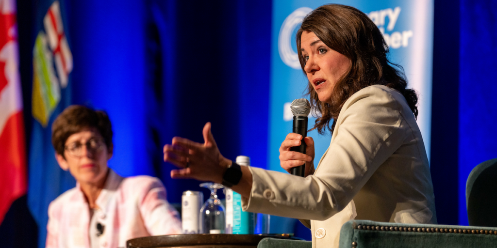 Alberta Premier Danielle Smith at the Calgary Chamber of Commerce’s armchair talk on Thursday, with Chamber President Deb Yedlin out of focus in the background.